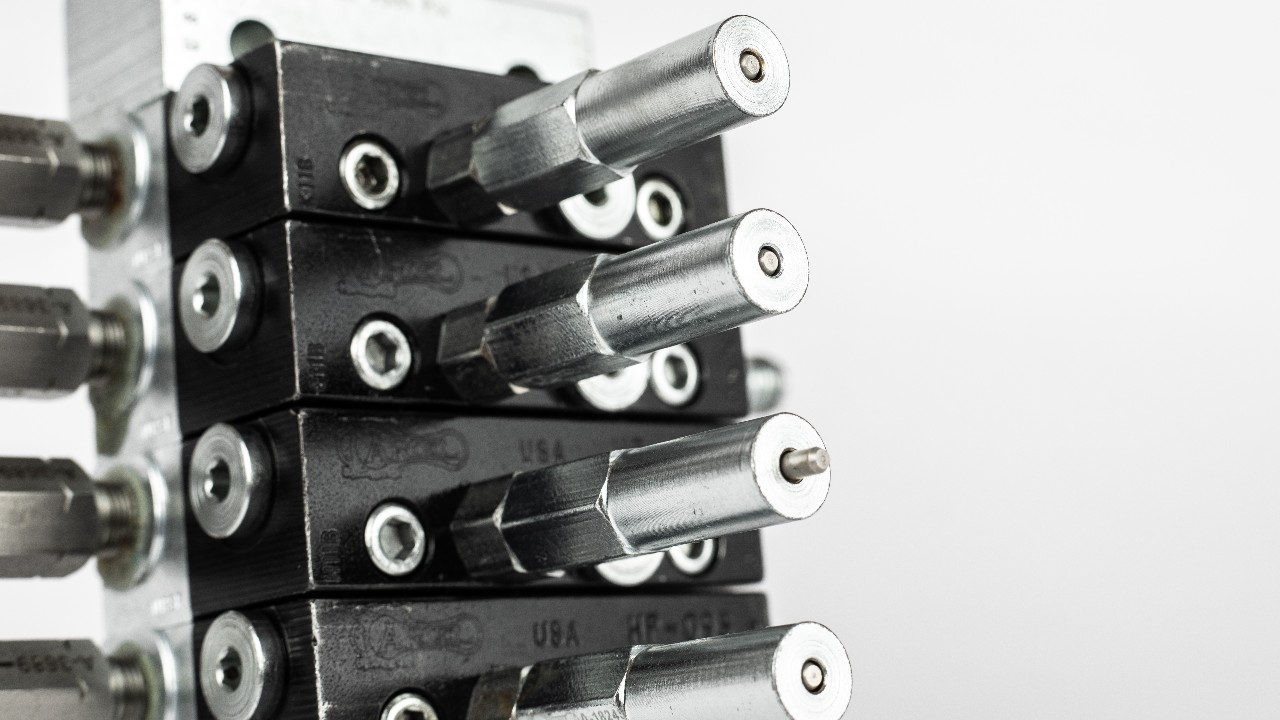 Detail of pin indicators on an ariel distribution block with a white background